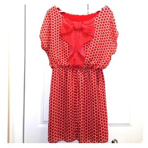 red and white poka dot dress with bow in the back